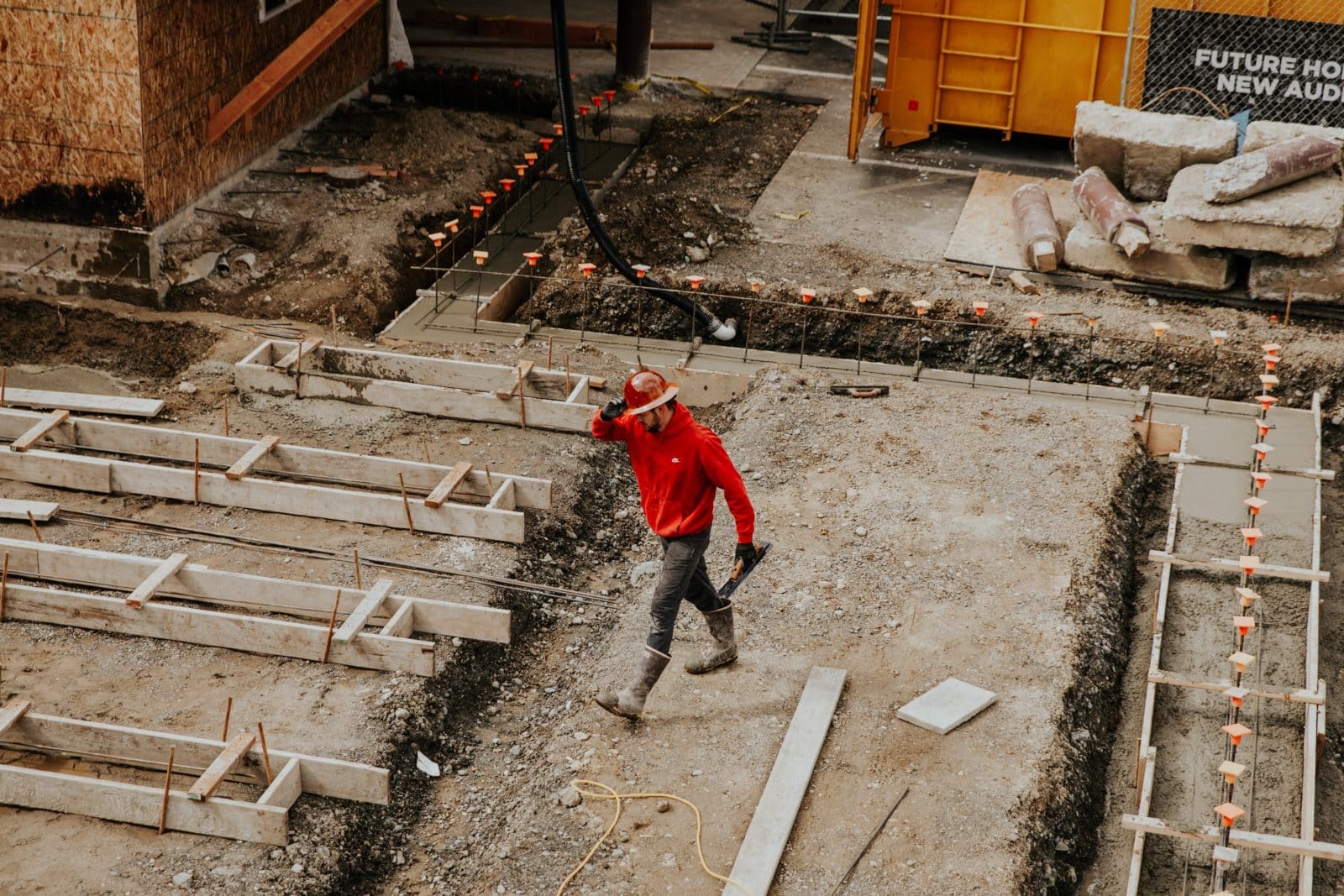 Construction worker building a school. 
